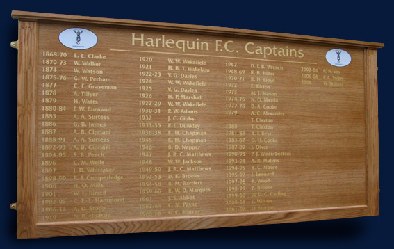 Quarter grained oak veneered honour board displaying the names of Harlequins rugby club captains since 1868