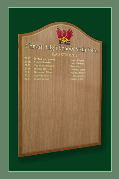 Oak honours board listing pupils achieving head student status at Cheam High School