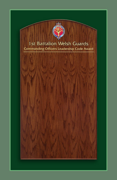 Commanding officers leadership code award honours board finished in golden red oak colour.