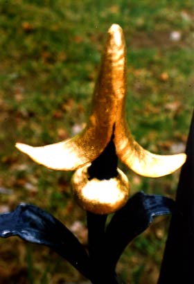 this repouse� fleur de lys at stretton park in cheshire has been gilded with gold leaf and shows rich colour