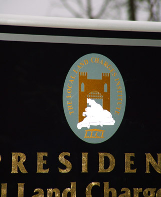 A close-up view showing the texture of the gold lettering and the LLCI logo