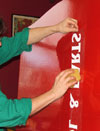 Wet your vinyl lettering before sticking it