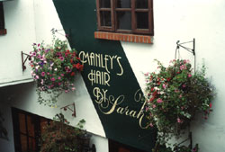 Shop front signs - signwriting on wall